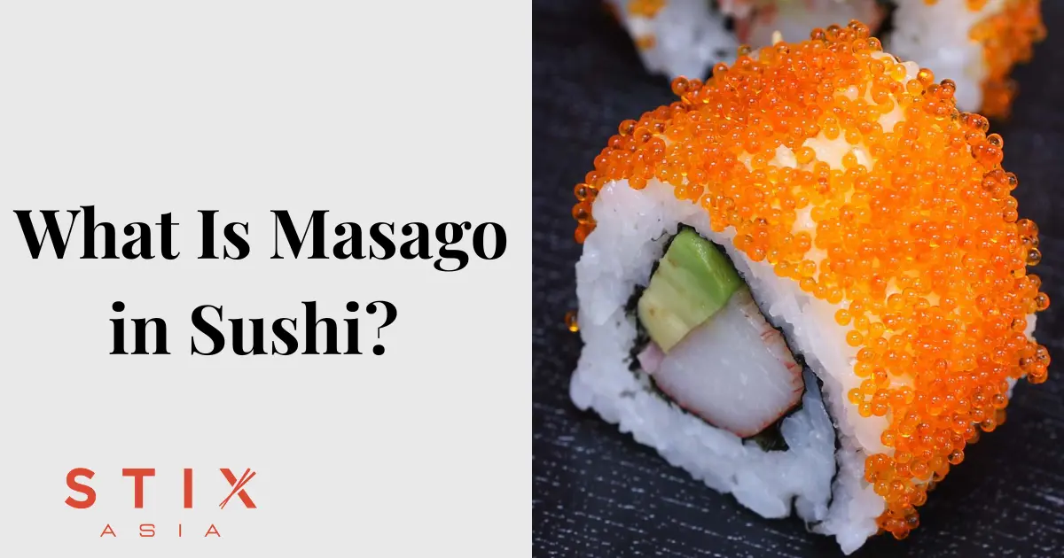 Three sushi rolls coated in bright orange roe, filled with crab meat and avocado, are displayed on a light background with chopsticks nearby.